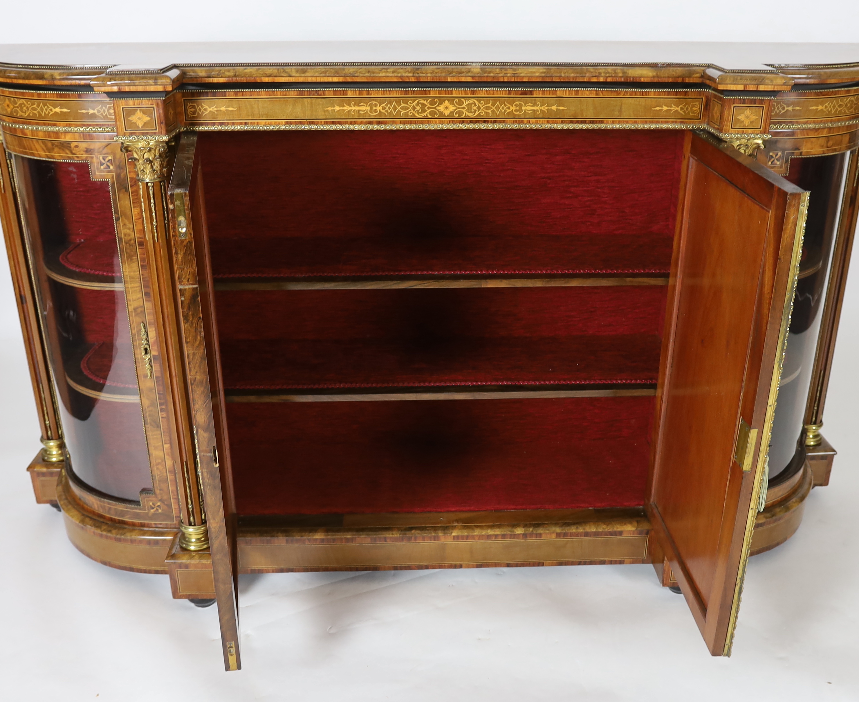 A Victorian marquetry inlaid figured walnut credenza 194cm wide, 49cm deep, 108cm high